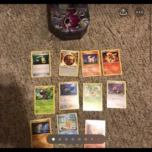 Pokémon cards and a Pokémon tin
